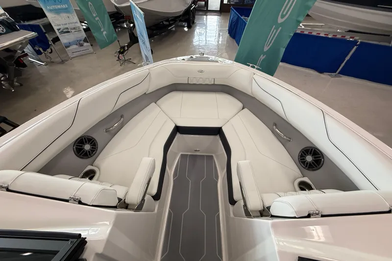 Slide: The Image of 2025 Regal LS2 Surf boat interior with white seating and modern design. - 51