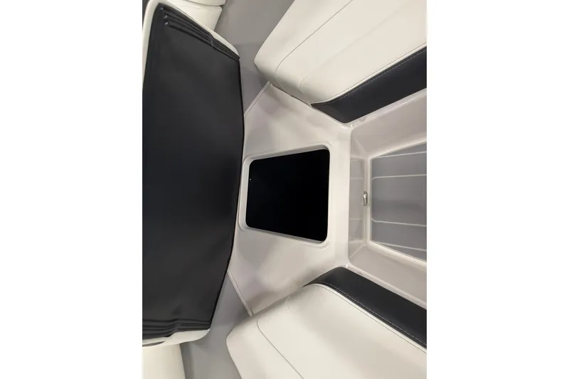 Slide: The Image of 2025 Regal LS2 Surf boat interior with sleek seating and storage compartment. - 54