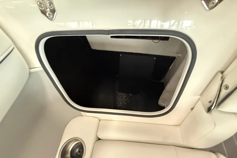 Slide: The Image of Interior storage compartment of 2025 Regal LS2 Surf boat, featuring sleek design. - 58