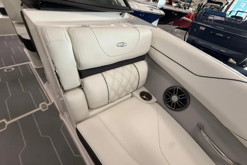 Slide: The Image of 2025 Regal LS2 Surf boat interior with white leather seating and speaker system. - 59