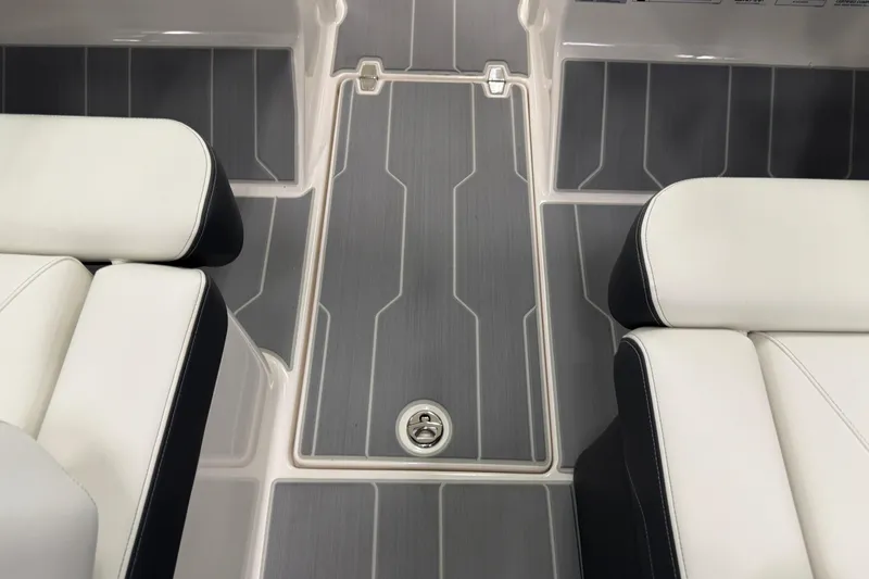 Slide: The Image of 2025 Regal LS2 Surf boat interior with sleek seating and modern flooring design. - 61