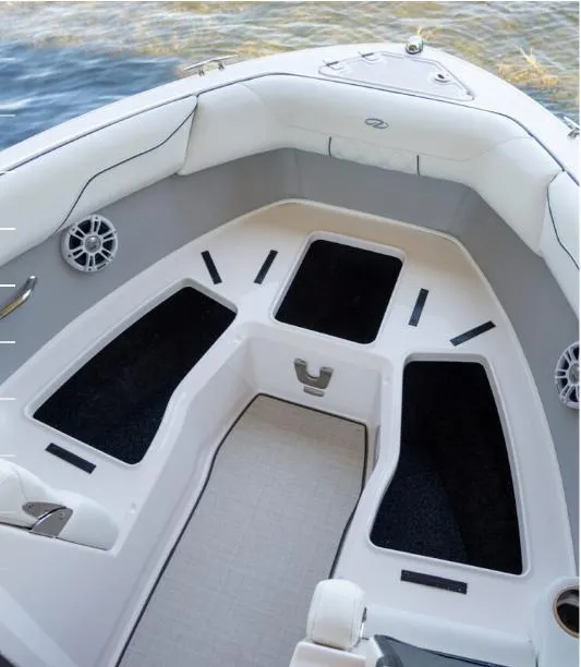 Slide: The Image of 2025 Regal LS2 Surf boat on trailer, showcasing propeller and hull design. - 8