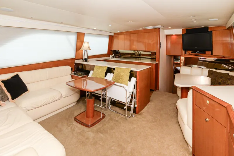 Slide: The Image of Luxurious interior of a 1999 Viking 55 Convertible yacht with elegant furnishings and modern amenities. - 34