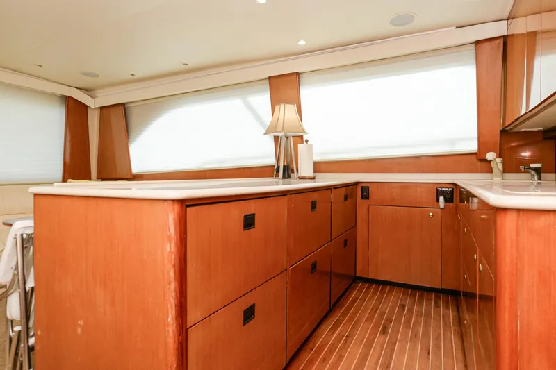 Slide: The Image of 1999 Viking 55 Convertible yacht interior with wooden cabinetry and modern design. - 43
