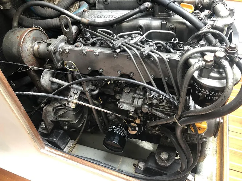 Slide: The Image of Engine of a 1991 Concordia Taylor 42 boat, showcasing intricate components and fuel filter. - 13