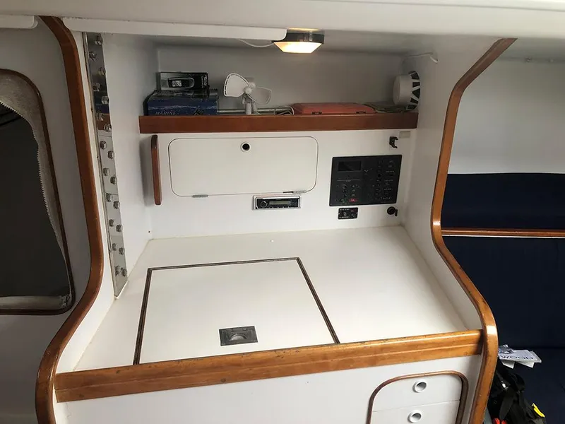 Slide: The Image of Interior of a 1991 Concordia Taylor 42 sailboat with navigation station and storage. - 14