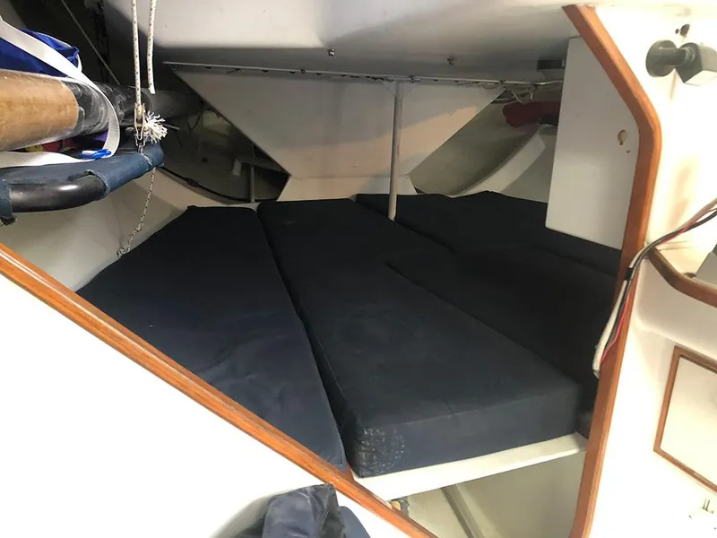 Slide: The Image of Interior cabin of 1991 Concordia Taylor 42 sailboat with blue cushions. - 16