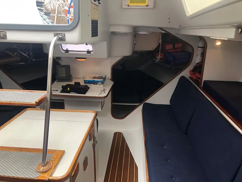 Slide: The Image of Interior of 1991 Concordia Taylor 42 sailboat with seating and navigation area. - 17