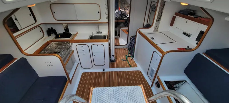 Slide: The Image of Interior of 1991 Concordia Taylor 42 sailboat with wood accents and compact kitchen. - 18