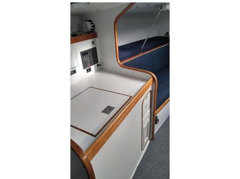 Slide: The Image of Interior of 1991 Concordia Taylor 42 sailboat with wooden trim and seating area. - 21