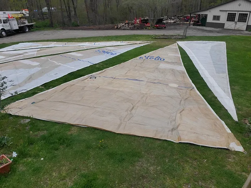 Slide: The Image of Sailboat sails laid out on grass, Concordia Taylor 42, 1991 model. - 27