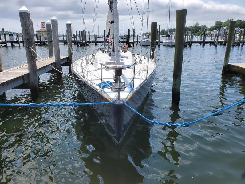 Slide: The Image of Sailboat Concordia Taylor 42, 1991 model, docked at marina with blue ropes. - 3