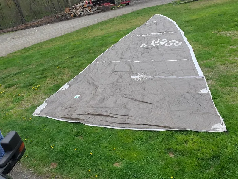 Slide: The Image of Sail from a 1991 Concordia Taylor 42 yacht laid out on grass. - 30