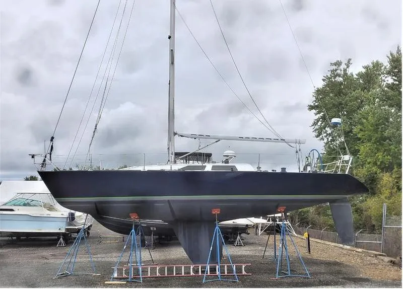 Slide: The Image of Sailboat Concordia Taylor 42, 1991 model, on stands in a boatyard. - 35