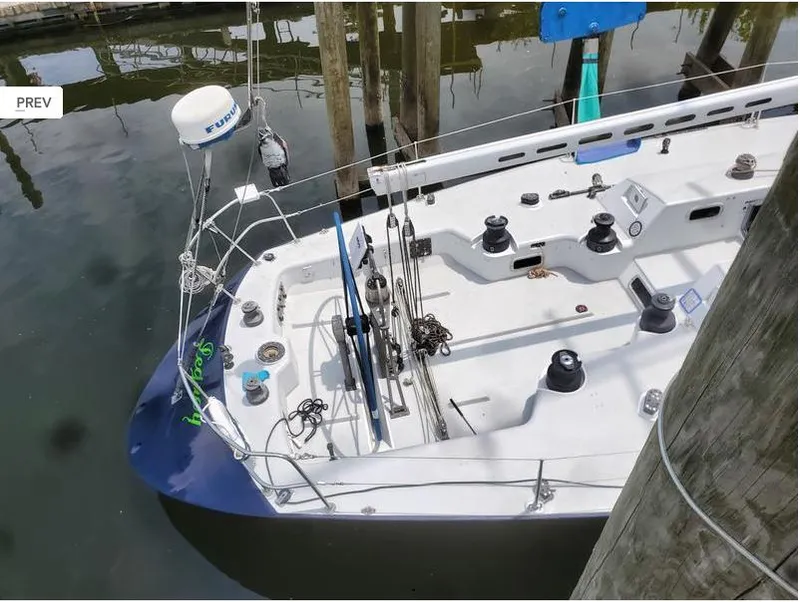 Slide: The Image of Sailboat docked, Concordia Taylor 42, 1991 model, featuring a clean deck and mooring lines. - 5