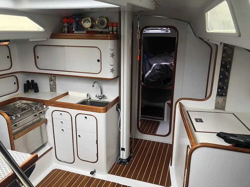 Slide: The Image of Interior of 1991 Concordia Taylor 42 yacht with compact kitchen and cozy cabin. - 8