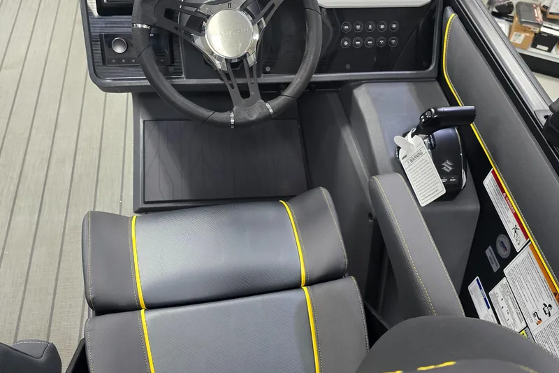 Slide: The Image of 2025 Manitou Explore Navigator interior with sleek steering wheel and modern dashboard design. - 7