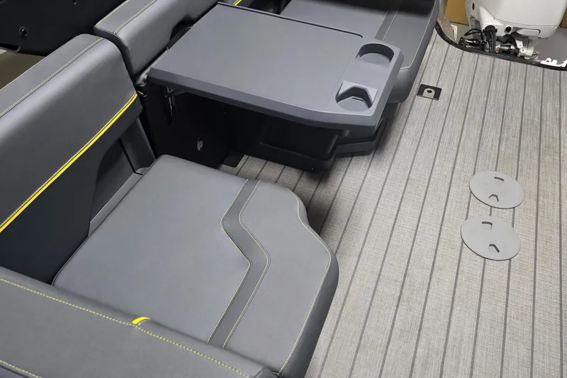 Slide: The Image of Interior seating of 2025 Manitou Explore Navigator with sleek design and integrated cup holders. - 8