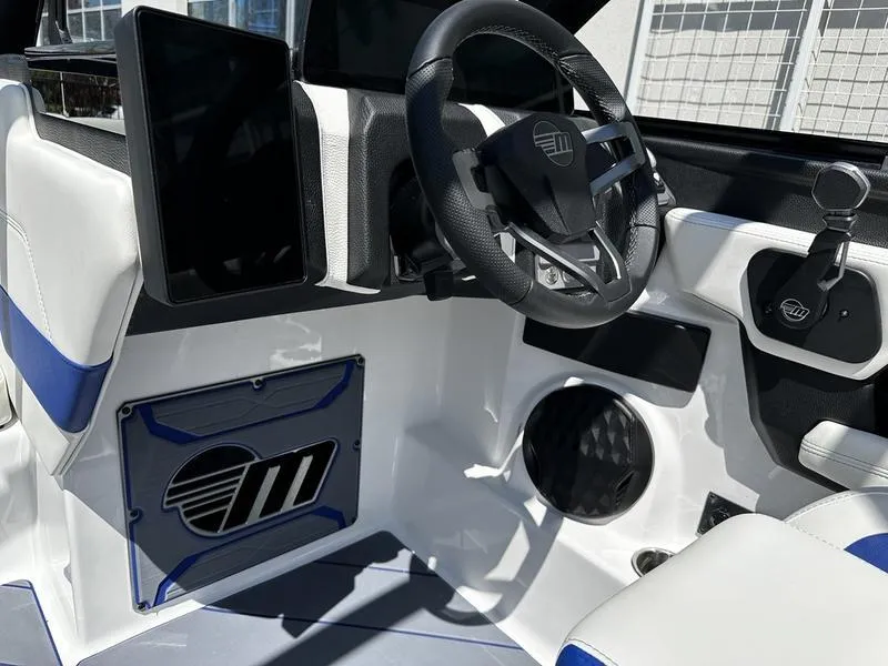 Slide: The Image of 2025 Malibu Wakesetter 23LSV interior with modern steering and dashboard design. - 10