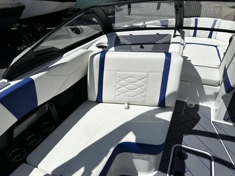 Slide: The Image of 2025 Malibu Wakesetter 23LSV interior with white and blue seating. - 8