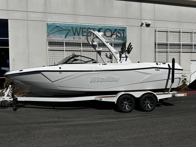 The Image of 2025 Malibu Wakesetter 23 LSV boat on trailer outside West Coast dealership. - 12