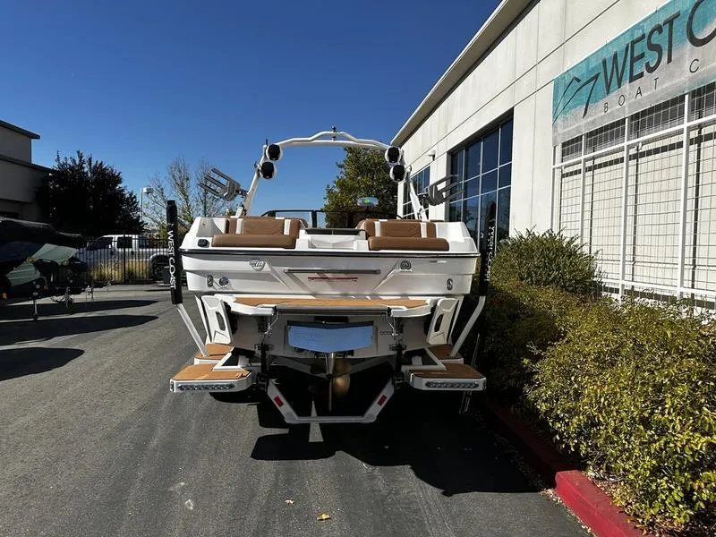 Slide: The Image of 2025 Malibu Wakesetter 23 LSV boat parked outside West Coast Boat Center. - 15