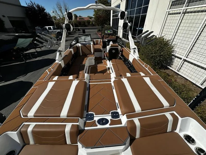 Slide: The Image of 2025 Malibu Wakesetter 23 LSV interior with brown and white seating. - 17