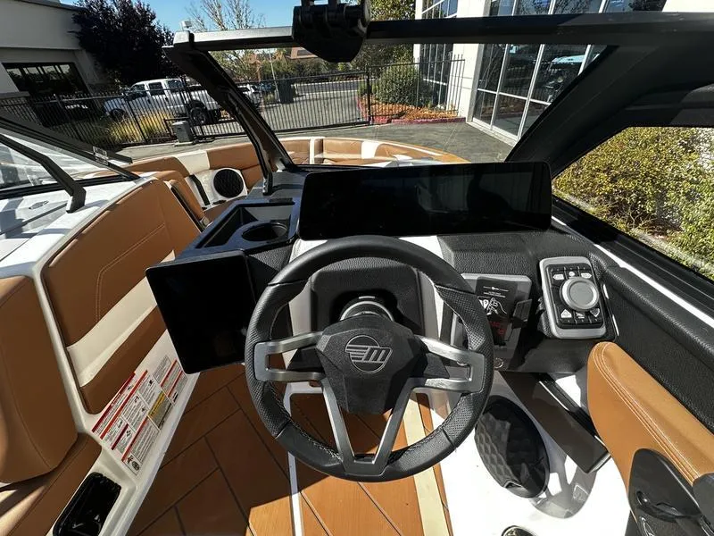 Slide: The Image of 2025 Malibu Wakesetter 23 LSV dashboard with modern steering and controls. - 20