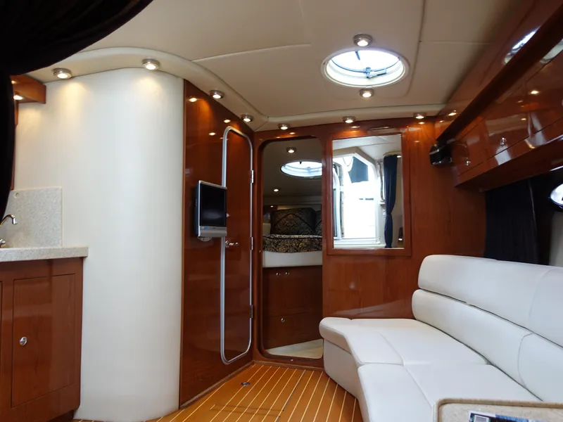 Slide: The Image of Luxurious interior of 2006 Regal 3560 Commodore yacht with modern furnishings. - 11