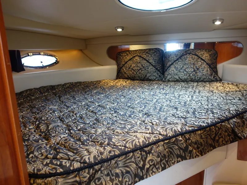 Slide: The Image of Luxurious cabin interior of 2006 Regal 3560 Commodore yacht with elegant bedding. - 14