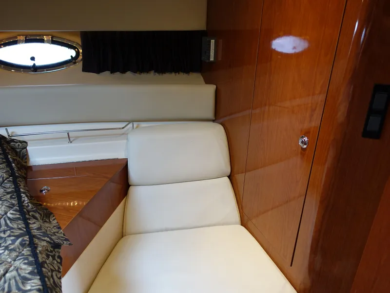 Slide: The Image of Interior of 2006 Regal 3560 Commodore yacht with elegant seating and wood finish. - 15