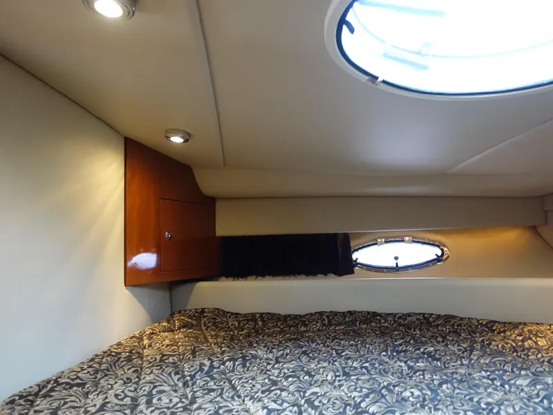 Slide: The Image of Interior cabin of 2006 Regal 3560 Commodore yacht with bed and porthole. - 16