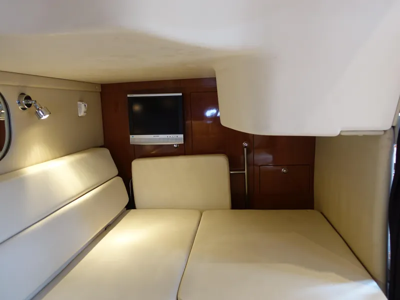 Slide: The Image of Interior cabin of 2006 Regal 3560 Commodore yacht with TV and seating. - 22
