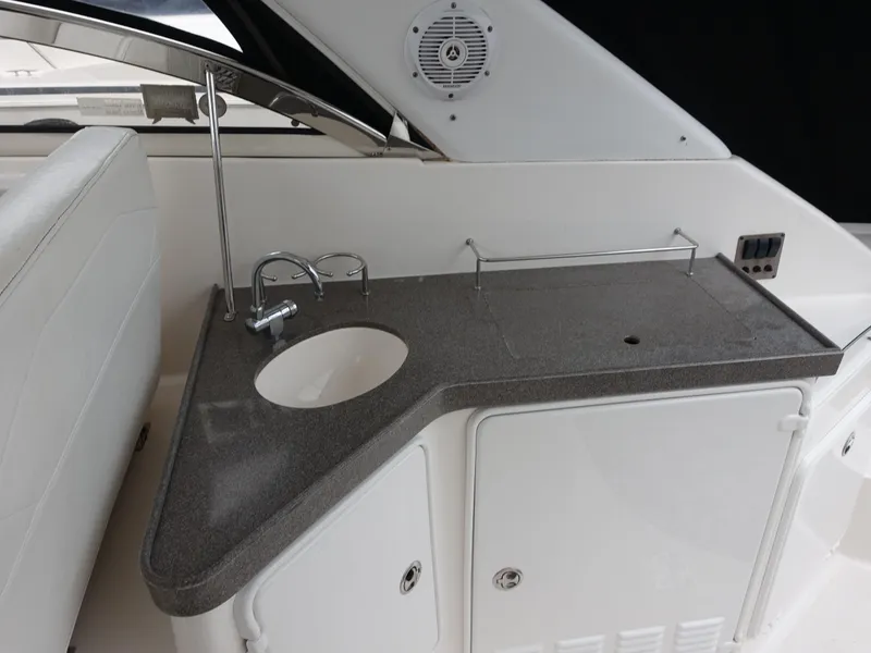 Slide: The Image of 2006 Regal 3560 Commodore yacht kitchenette with sink and countertop. - 6