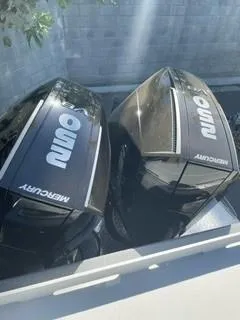 Slide: The Image of Two black Mercury outboard motors on a Spartan 2600 Olympia, 2025 model. - 14