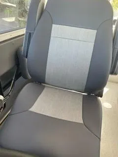 Slide: The Image of 2025 Spartan 2600 Olympia vehicle seat with gray and black upholstery. - 19