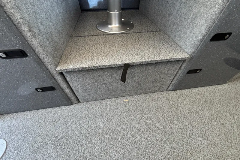 Slide: The Image of Interior of 2025 Spartan 2600 Olympia, featuring gray textured flooring and seating. - 28