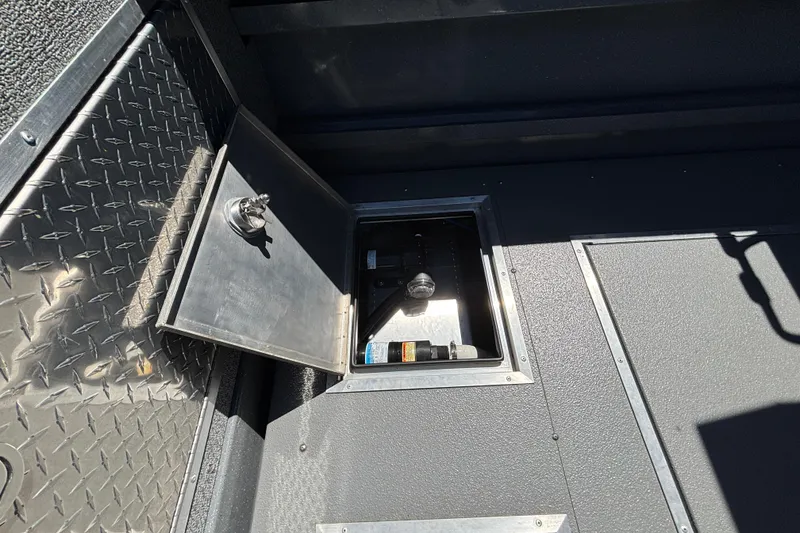 Slide: The Image of Interior compartment of 2025 Spartan 2600 Olympia with open access panel and storage. - 16