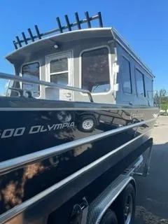 Slide: The Image of 2025 Spartan 2600 Olympia boat with sleek design and modern features. - 2