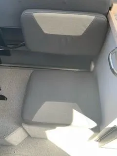 Slide: The Image of Gray seating in a 2025 Spartan 2600 Olympia boat interior. - 22