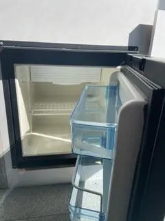 Slide: The Image of Open Spartan 2600 Olympia refrigerator, 2025 model, showing empty interior and door shelves. - 26