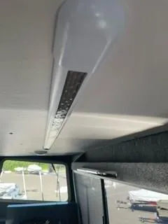 Slide: The Image of Interior view of a 2025 Spartan 2600 Olympia, featuring a ceiling light fixture. - 31