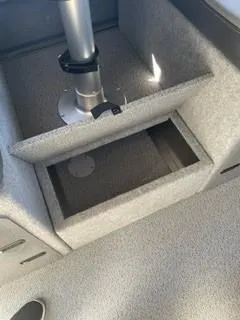 Slide: The Image of 2025 Spartan 2600 Olympia interior storage compartment with metallic support pole. - 33