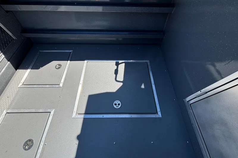Slide: The Image of Interior of 2025 Spartan 2600 Olympia with secure storage compartments and sleek design. - 53