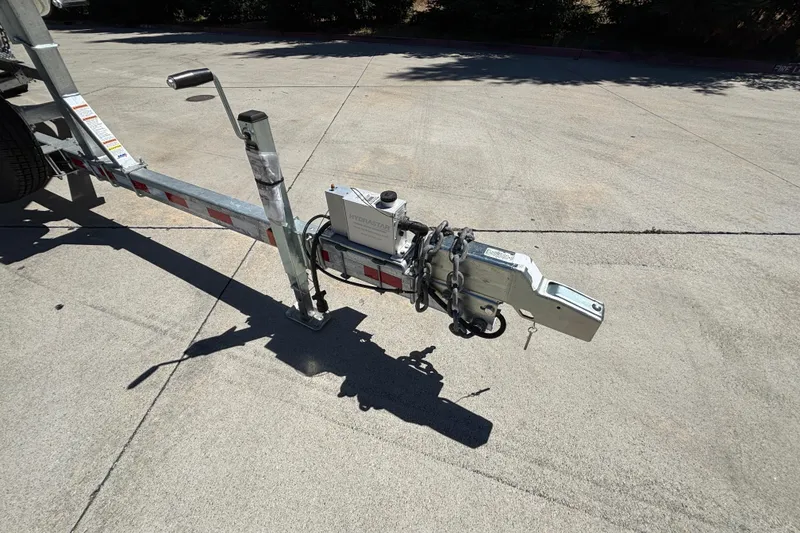Slide: The Image of Trailer hitch of 2025 Spartan 2600 Olympia on concrete surface. - 24