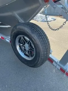 Slide: The Image of 2025 Spartan 2600 Olympia trailer with spare tire mounted on the side. - 8