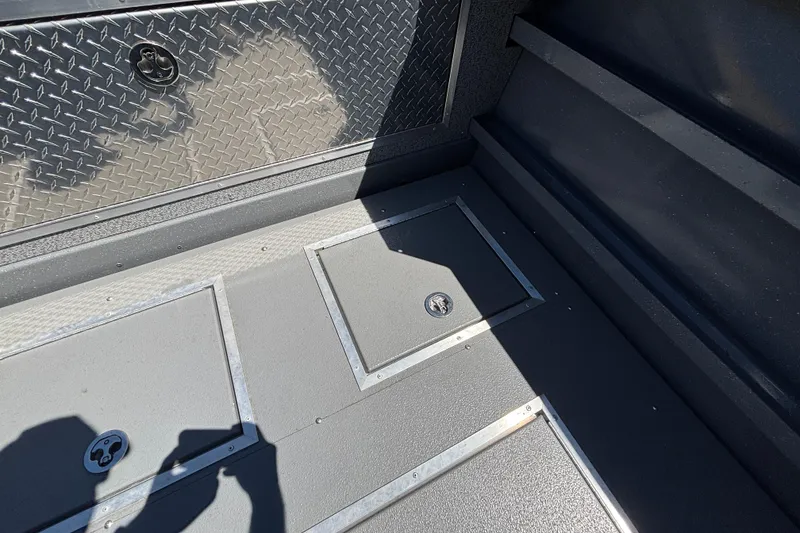 Slide: The Image of Interior of 2025 Spartan 2600 Olympia with diamond plate and storage compartments. - 17
