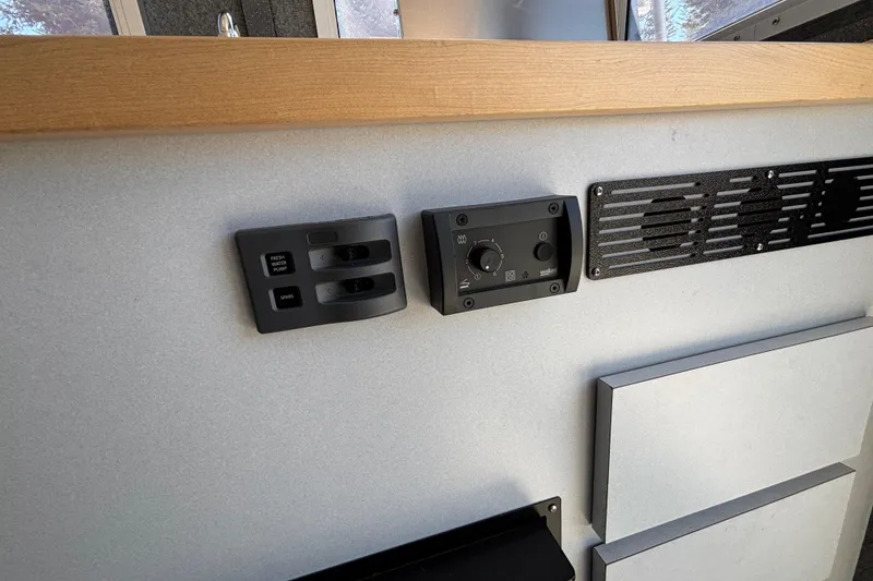 Slide: The Image of Control panel and vent in 2025 Spartan 2600 Olympia interior, featuring modern design elements. - 61