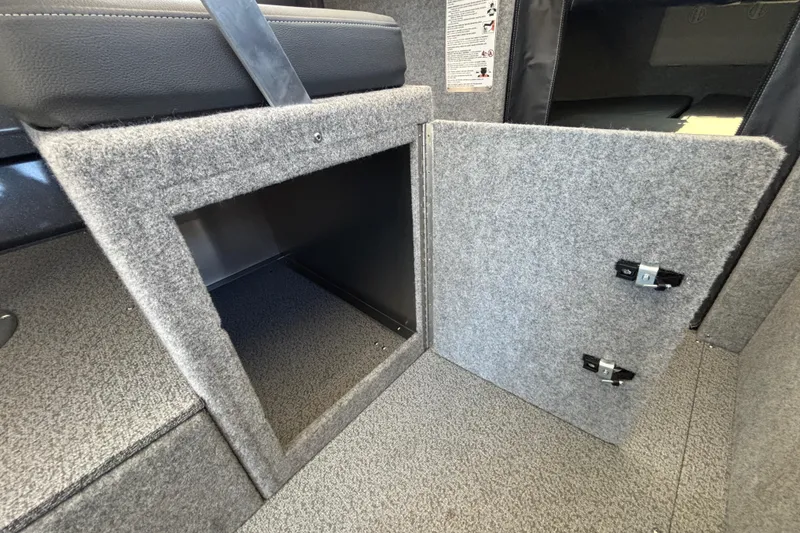 Slide: The Image of Interior storage compartment of 2025 Spartan 2600 Olympia with open carpeted door. - 43