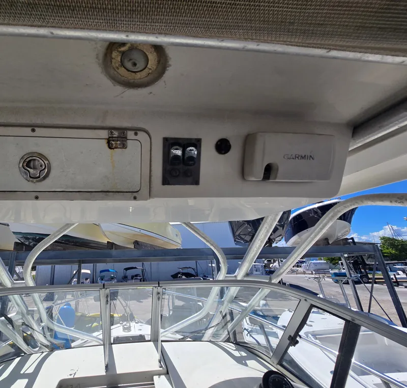 Slide: The Image of 2015 Sailfish 270 WAC boat interior with Garmin equipment and control panel. - 9
